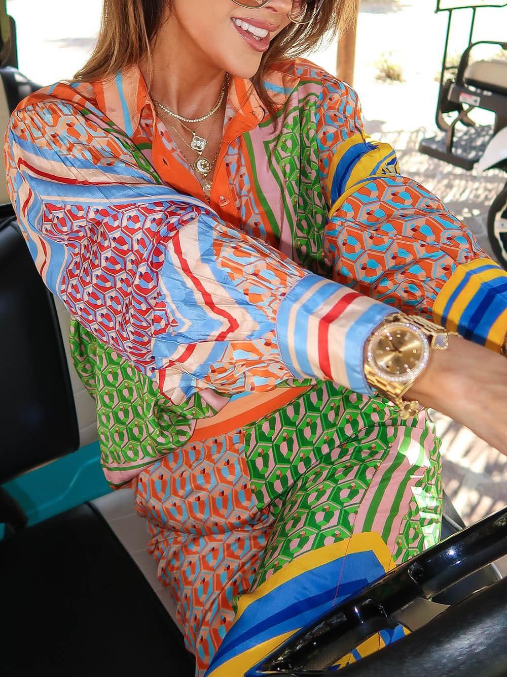 Calças Bloomer folgadas com estampa colorida exclusiva, cintura elástica e bolsos.