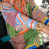 Calças Bloomer folgadas com estampa colorida exclusiva, cintura elástica e bolsos.