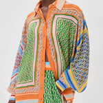 Calças Bloomer folgadas com estampa colorida exclusiva, cintura elástica e bolsos.