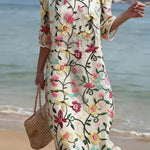 VESTIDO DE PLAYA CON BORDADO FLORAL – CORTE SUELTO