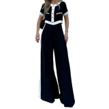 Conjunto de duas peças elegante e casual, composto por top curto e calça reta.