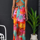 Vestido longo floral com decote em V, sem mangas, amarração nas costas e fenda.