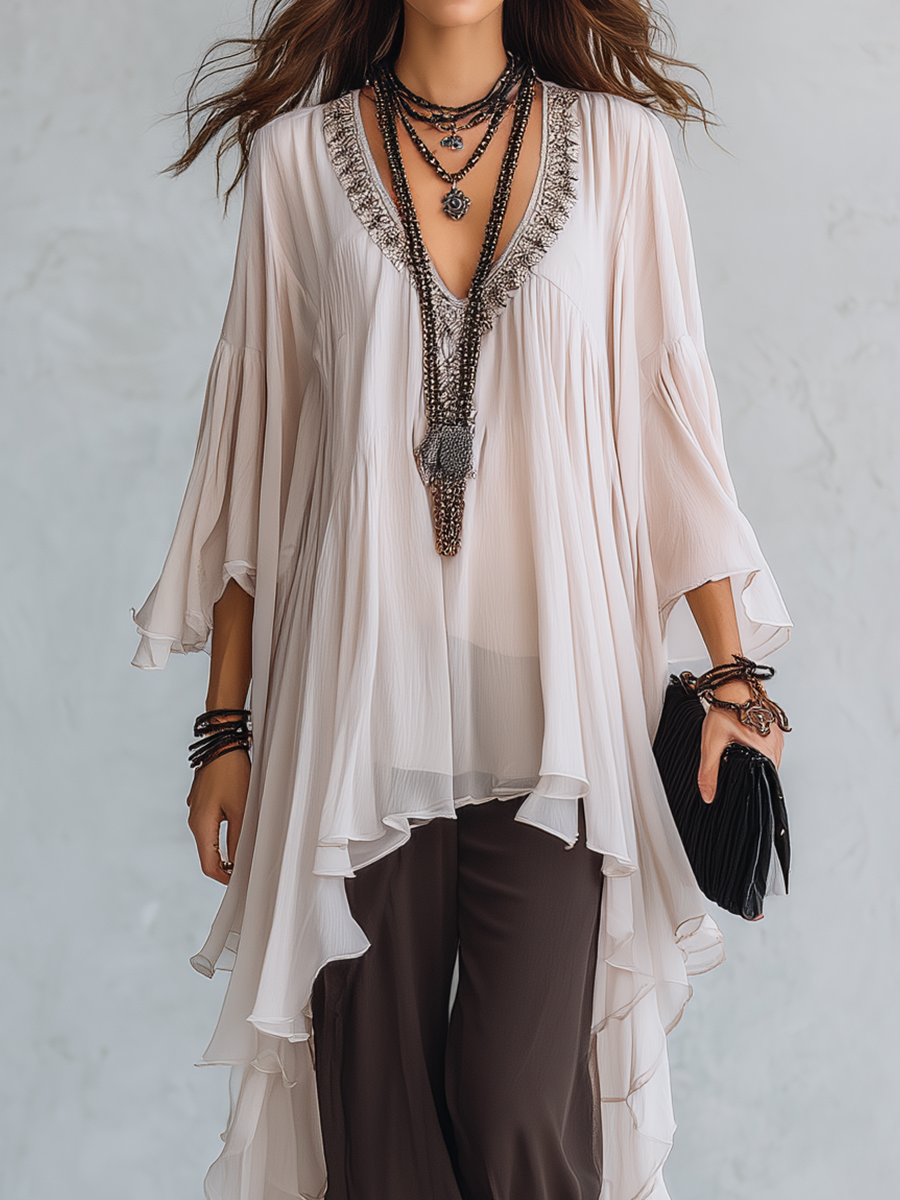Off-white Layered Chiffon Top Paired With Brown Flared Trousers.