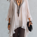 Off-white Layered Chiffon Top Paired With Brown Flared Trousers.