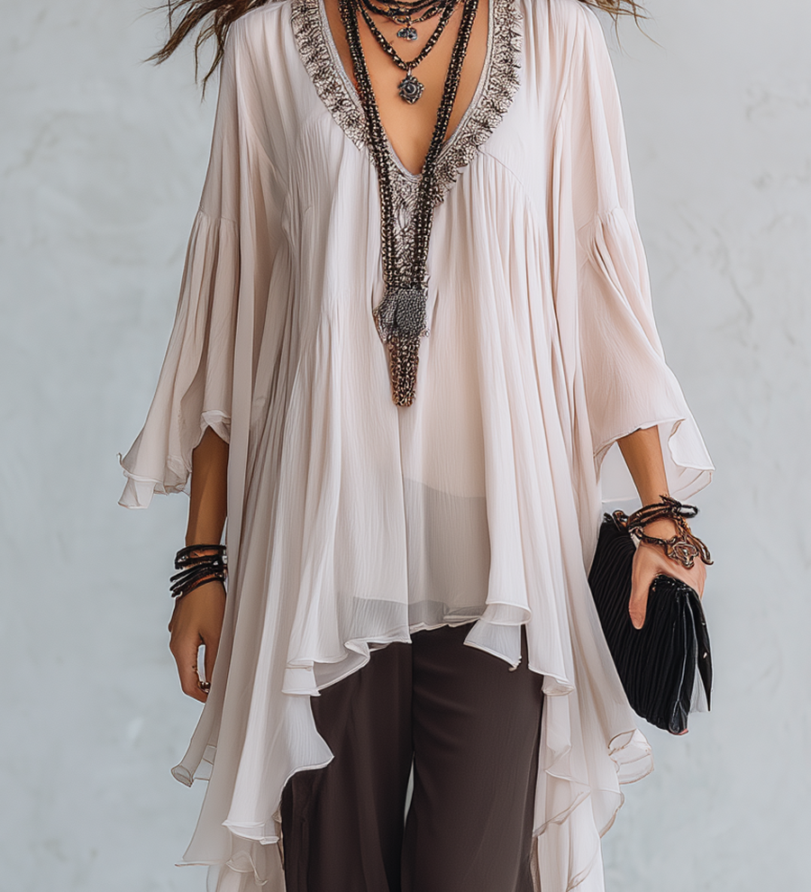 Off-white Layered Chiffon Top Paired With Brown Flared Trousers.