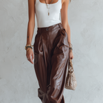 Minimalist Top Paired With Loose, Faux Leather Harem Pants.