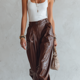 Minimalist Top Paired With Loose, Faux Leather Harem Pants.