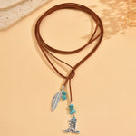 COLLAR VINTAGE BOHEMIO TURQUESA PLUMA COLGANTE SUPERPUESTO