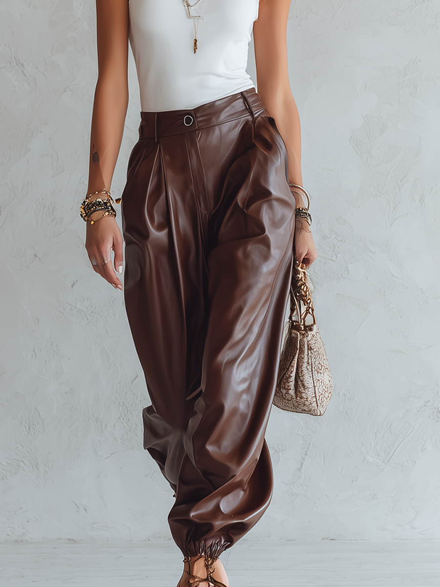 Minimalist Top Paired With Loose, Faux Leather Harem Pants.