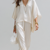 Minimalist Design Off-white Textured Suit With Batwing Sleeves.