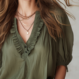 Military Green Top With Ruffled Details And Puff Sleeves.