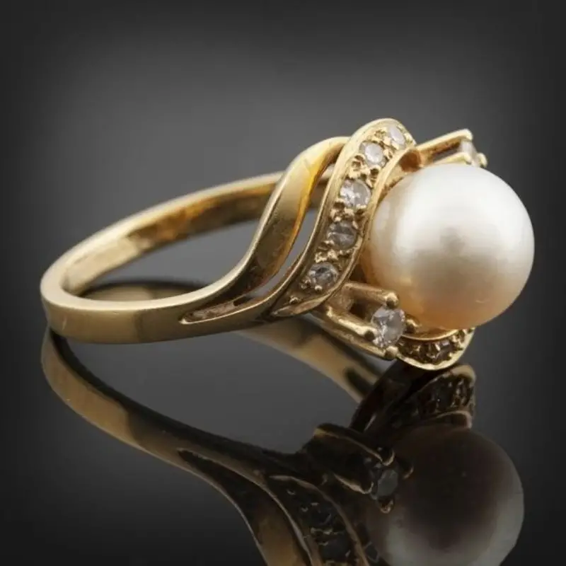 ANILLO ELEGANTE CON PERLA Y BRILLANTE ORO