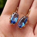 PENDIENTES DORADO AZUL FLOR FLORECIDA